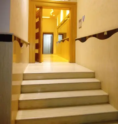 a hallway with stairs in a building at Appart prestigieux+T bien équipé in Fès