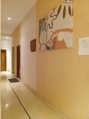 an empty hallway with a painting on the wall at Appart prestigieux+T bien équipé in Fès