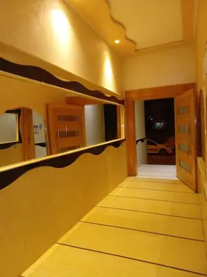 a hallway of a house with a door and a window at Appart prestigieux+T bien équipé in Fès