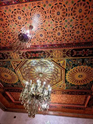 a chandelier hanging from the ceiling of a building at Fassia in Fès