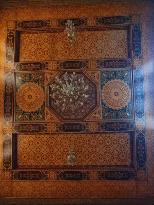 a ceiling of a building with a painting on it at Fassia in Fès