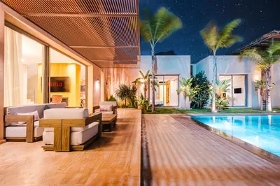 a villa with a swimming pool and a house at Dar ilyan in Marrakech