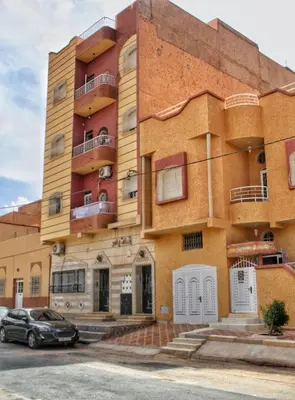 a building with a car parked in front of it at Yassers Residence in Er Rachidia