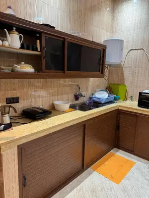 a kitchen with a counter top with a sink at Motia's farm in Marrakech