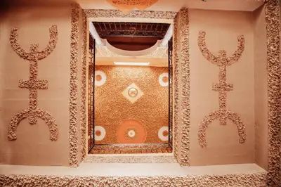 a room with two mirrors on the wall at Traditional Riad Merzouga Dunes in Merzouga