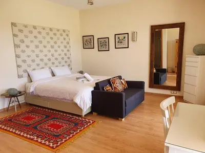 a bedroom with a bed and a chair and a mirror at Dar Lalla Mhalla Villa 975m2 5ch - Rt de Fes in Marrakech
