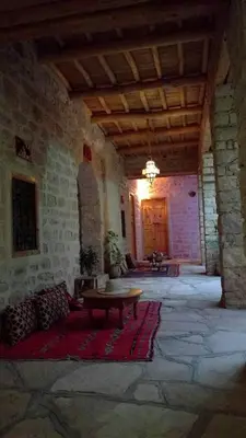 a large room with a table in a building at Kasbah Dar Talouste in Afela nʼIsly