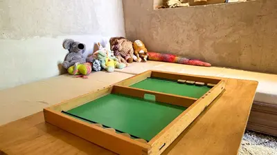 a wooden table with a trampolineituresasteryasteryasteryasteryasteryasteryastery at Alliance Berbère - Vallée d'Aït Bouguemez in Timit