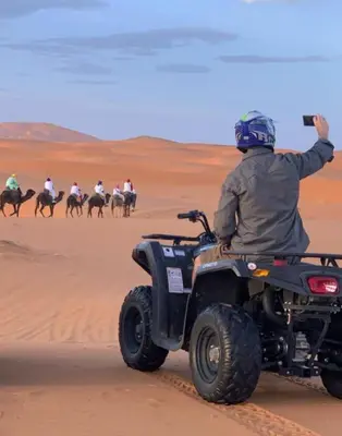 a person on a wheeler in the desert at Holiday Desert Camp in Merzouga