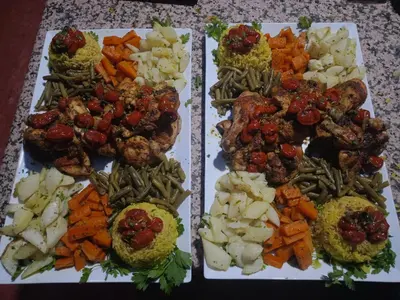 three plates of food with different types of vegetables at Merzouga starlit desert camp in Hassilabied