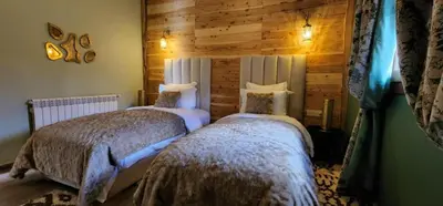a bedroom with two beds in a room at Chalets-Appartements Tourtite in Ifrane