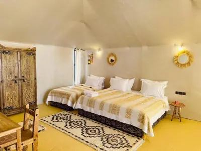 a bedroom with two beds in a room at Diament Luxury Camp-Sahara Desert Experience in Merzouga in Merzouga
