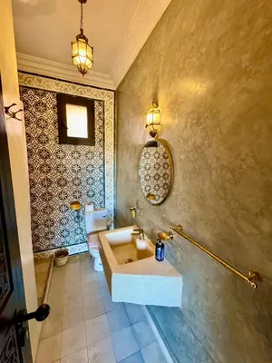 a bathroom with a sink and a toilet at Riad Timskrine in Ourika