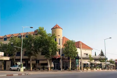a building with a tower on top of a street at Hôtel La Chambotte in Imouzzer Kandar