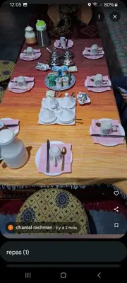 a long table with plates and dishes on it at Hotel AZUL Todra Gorges in Tinerhir