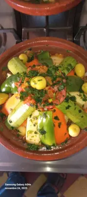 a bowl of food with vegetables on a table at Hotel AZUL Todra Gorges in Tinerhir