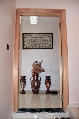 two vases sitting on a shelf in a room at Appartement Azurite - Traditionnel & spacieux in Fès