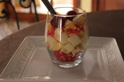 a glass vase filled with fruit on a table at Kasbah lucas in Akhendachou nʼAït Ouffi