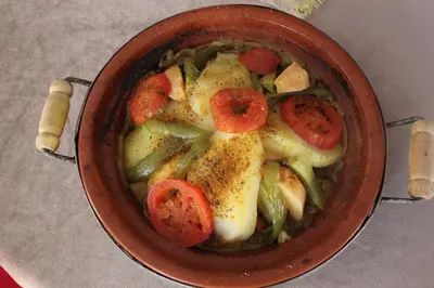 a bowl of food with tomatoes and vegetables at Kasbah lucas in Akhendachou nʼAït Ouffi