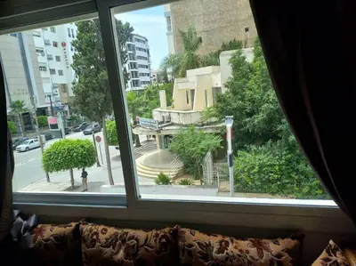 a window with a view of a city street at Appart. Bien équipé centre ville in Fès