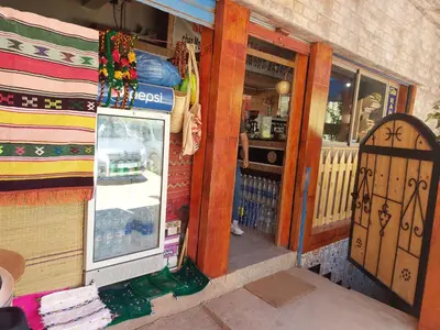 a store entrance to a store with a door at Gite Rahhaoui Simo in Kasba des Aït Moussa