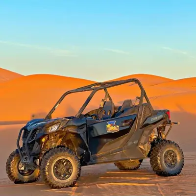 a black atv parked in the desert at Sahara Magic luxury Camp in Merzouga