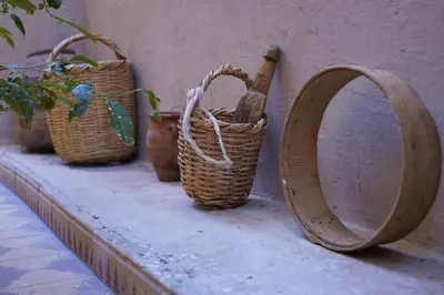 a group of baskets sitting on a ledge at CHEZ MANAR in Ouarzazate