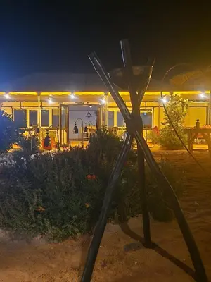 a statue in front of a restaurant at night at marvelous luxury desert stars in Merzouga