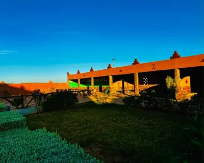 a building in the middle of a field at COMPLEXE L'OASIS in Erfoud