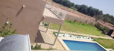 an overhead view of a basketball hoop next to a pool at Villa 30 km a Marrakech in Marrakech