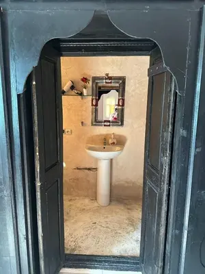 a bathroom with a sink and a mirror at Villa MsHolidays Victoria privatisée Marrakech in Marrakech