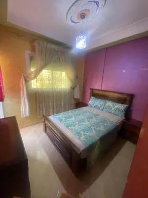 a bedroom with a bed and a window at اقامة قرب حمام my yaacup in Moulay Yacoub
