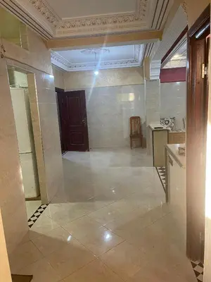 an empty room with a kitchen and a door at اقامة قرب حمام my yaacup in Moulay Yacoub