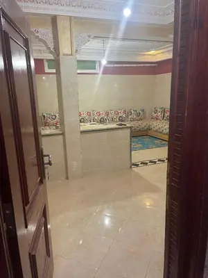 a bathroom with a row of benches in a room at اقامة قرب حمام my yaacup in Moulay Yacoub
