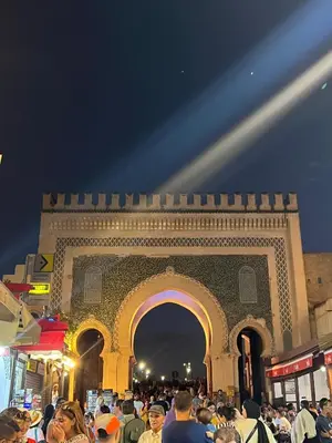 a crowd of people standing in front of a building at Dar Achraf in Fès