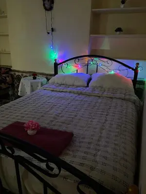 a bedroom with a bed with lights on it at Dar Achraf in Fès