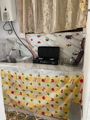 a kitchen with a counter with a phone on it at Dar Achraf in Fès