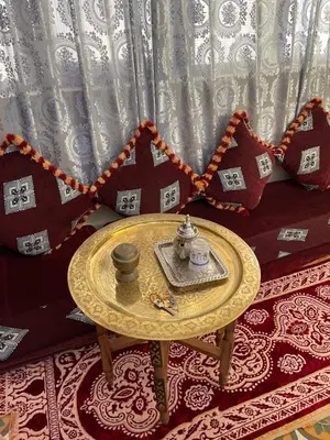 a table with a tea set on it in a room at Dar Achraf in Fès
