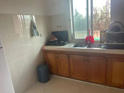 a kitchen with a sink and a window at تازة in Taza