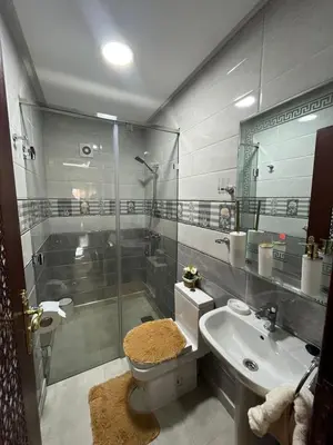 a bathroom with a shower and a toilet and a sink at APPART HOTEL OUED EDDAHAB in Khenifra