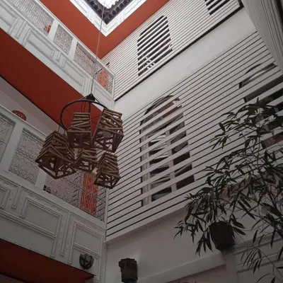 a chandelier hanging from a ceiling in a room at DAR ORANGE in Fès