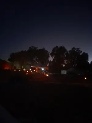 a view of a house at night with cars at Auberge chez hammadi in Zagora