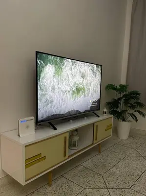 a flat screen tv sitting on top of a cabinet at Chez Siham in Fès