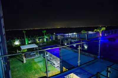 a view from the top of a building at night at Villa moderne Marrakech in Marrakech