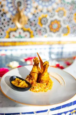 two food items on a plate on a table at RIAD GOLD in Azrou