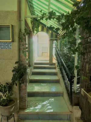 a stairway in a building with a green ceiling at Ighbola Ouzoud in Ouzoud