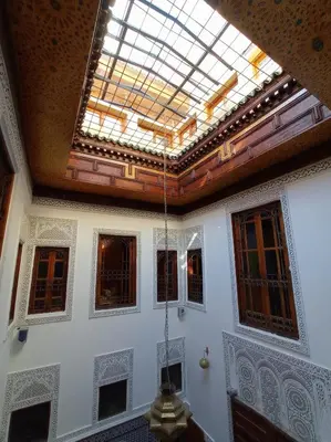 a ceiling with a skylight in a room with windows at Riad Dar Lalj Fes in Fès