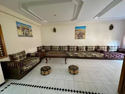a large living room with couches at Jawhara Jacobs apartment in Fès