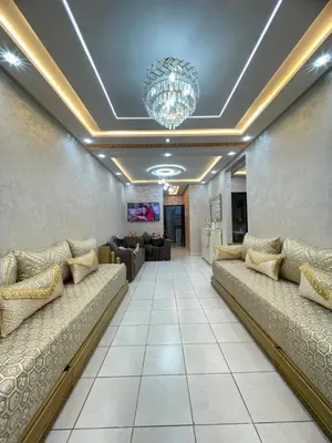 a waiting room with couches and a chandelier at Oued fes hay molay driss in Fès
