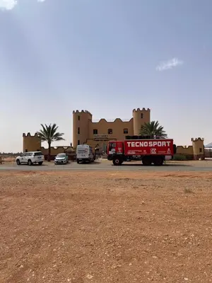a red truck parked in front of a building at Palm Garden in Erfoud